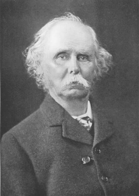 Portrait en noir et blanc de l'économiste Alfred Marshall, un homme âgé à la moustache blanche.