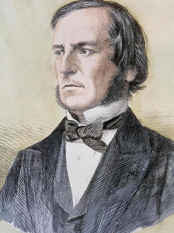 Un portrait du XIXe siècle de George Boole, un homme aux cheveux et favoris sombres en tenue victorienne.