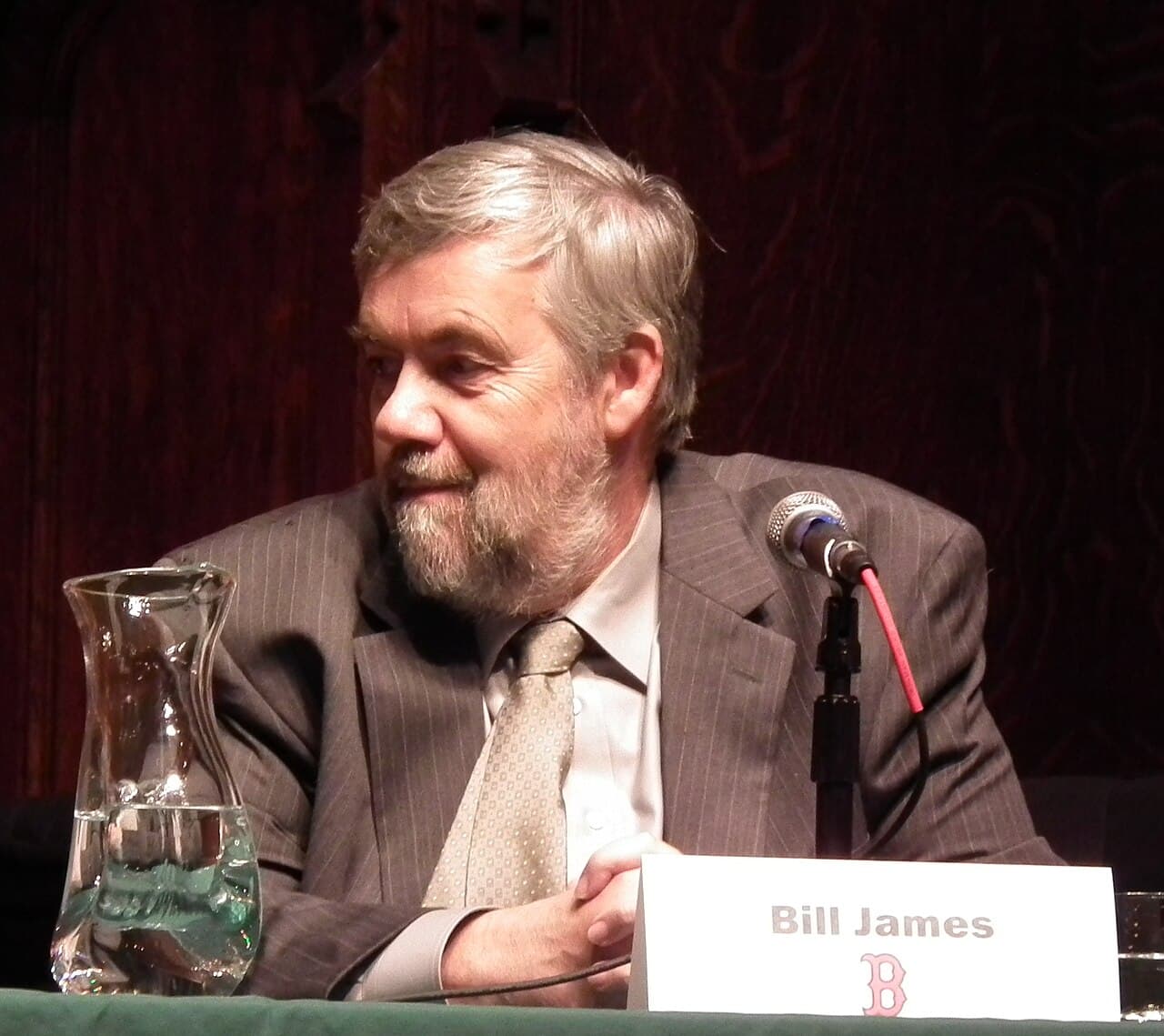 Portrait photo of Bill James, a bearded man in glasses, in 2010.